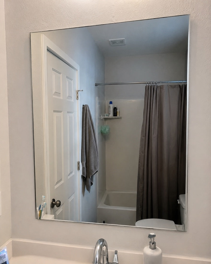 Customer photo of a clear bathroom mirror