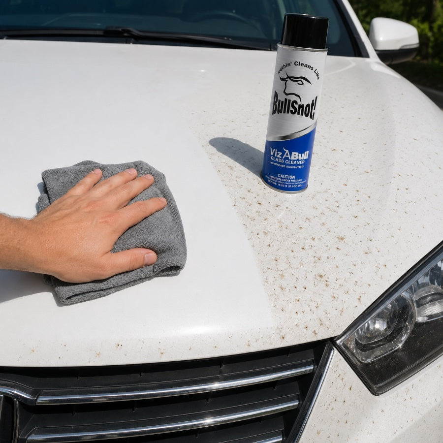 A bug-covered white hood with a clean wiped stripe next to a can of VizABull