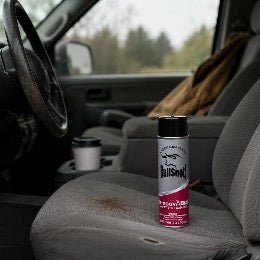 A grease and oil stain on a work truck seat