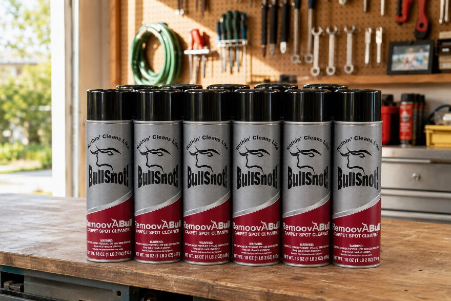 A twelve-pack of RemoovABull cans on a workbench